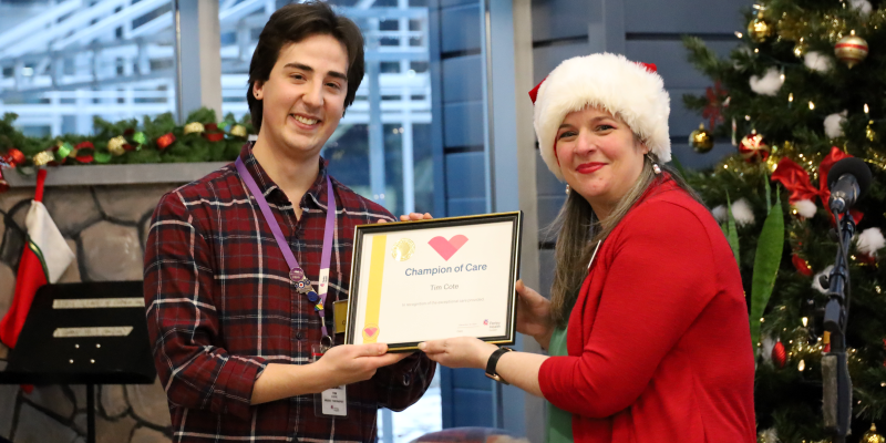 Michelle Proulx, Manager, Therapeutic Recreation and Creative Arts presents Tim Cote, Music Therapist with a Grateful Family Champion of Care certificate. Tim's dedication exemplifies the exceptional care that is possible, thanks to your support. Grateful Family Presentation - Tim.png